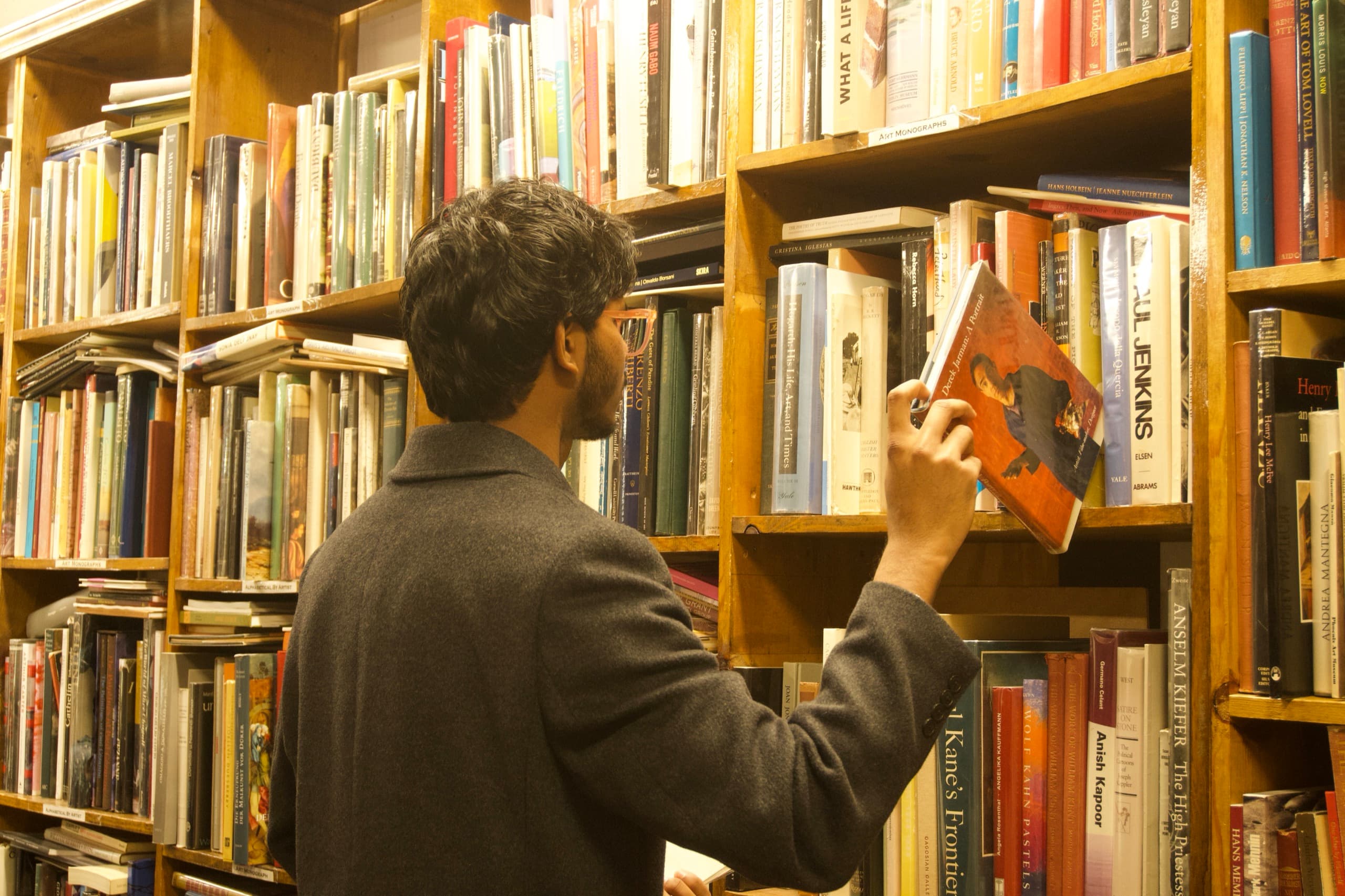 A reader browsing the shelves of a bookshop